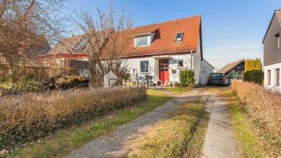Sanierungsbedürftige Doppelhaushälfte mit 6 Zimmern, großem Grundstück und viel Potenzial