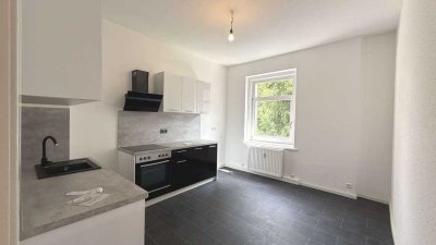 Helle 2-Zimmer-Wohnung mit schöner Wohnküche zum grünen Innenhof