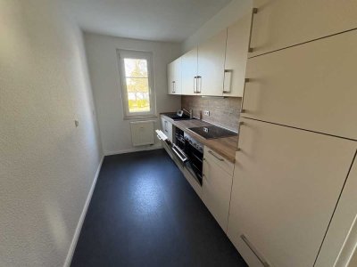 Sonnige Zwei-Raum-Wohnung mit Einbauküche