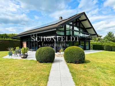 Design trifft Natur – stilvolles Wohnen im HUF HAUS auf parkähnlichem Grundstück