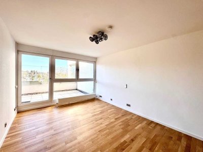 Charmante 1-Zimmer-Wohnung mit Balkon, Weitblick und TG-Stellplatz in beliebter Halbhöhenlage.