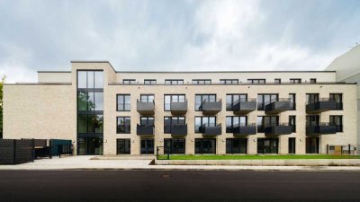 Neubau: 2-Zimmer-Wohnung mit Einbauküche, Terrasse und TG-Stellplatz