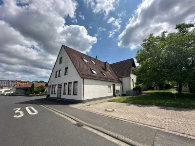 Attraktives Mehrfamilienhaus mit 4 Wohneinheiten & 2 Gewerbeeinheiten mit zusätzlichem Baugrundstück