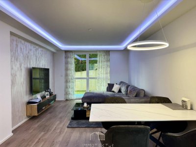 GARTENWOHNUNG: Modernisierte 2-Zimmer-Wohnung mit Tiefgarage und großem Kellerabteil