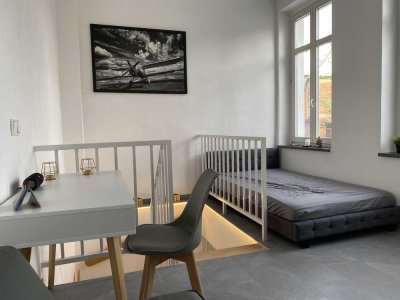 # Frisch renoviertes Design-Apartment - voll möbliert, 2 Bäder & Garten inkl. WLAN in zentraler Lage
