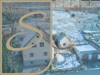 Einfamilienhaus mit begonnenem Ausbau und zwei Garagen!!