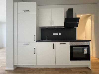 Schöne Wohnung: günstig geschnittene 1-Zimmer-Wohnung mit Einbauküche im Erstbezug