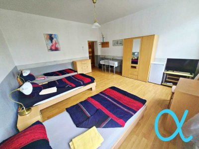 Wohn- & Geschäftshaus mit etabliertem Gastronomiebetrieb und zwei möblierten Wohnungen