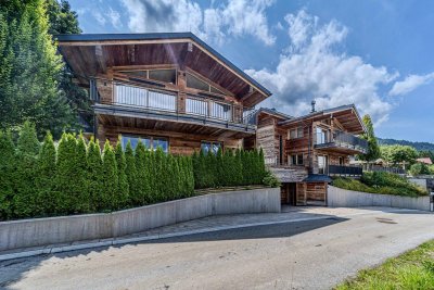 Edle Chalets in „Ski-in &amp; Ski-out“-Lage mit imposanten Kaiserblick