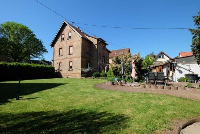 3-Familienhaus mit Ladeneinheit und zusätzlichem Baugrund