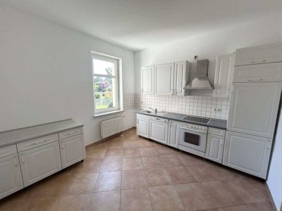 Ideal für Paare & Senioren -  2 Zimmer mit Einbauküche, Tageslichtbad, Garten  & Stellplatz