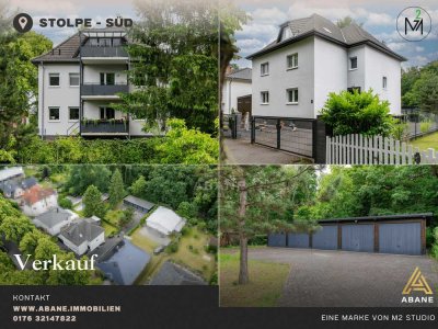 Investor oder Eigennutzer: Vielseitiges Dreiparteienhaus mit 6 Garagen in Stolpe-Süd