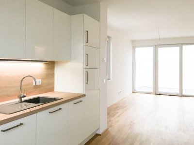 Moderne und helle Zwei-Zimmerwohnung mit Loggia und Skyline-Blick inkl. Küche