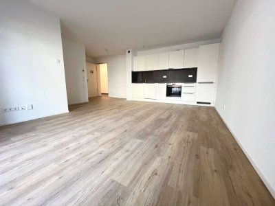 *NEUBAU* Lichtdurchflutete Erdgeschosswohnung mit Terrasse und eigenem Gartenanteil !