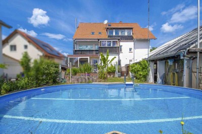 Viel Platz zum Leben –Zweifamilienhaus mit Wintergarten, Dachterrasse und Garten in Riedstadt