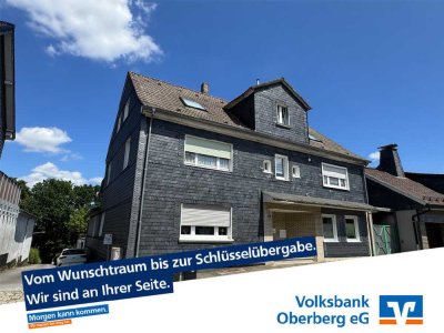 Attraktives Dreifamilienhaus mit neuer klimafreundlicher Pelletheizung, 
4 Garagen und 3 Stel