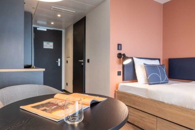 Furnished micro apartments, community areas, coworking & gym close to BMW