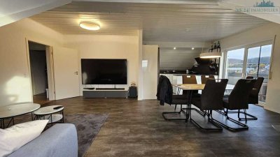 Attraktive 5,5ZKB Wohnung mit offener Einbauküche, Kamin, 2 Balkone sowie PKW Aussenstellplatz