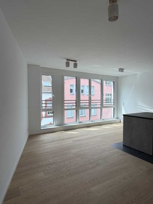 3-Zimmer-Neubauwohnung im Erstbezug mit Balkon & hochwertiger EBK in charmanter Fußgängerzone
