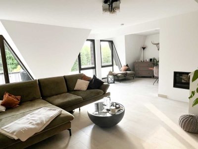 Lichtdurchflutete Maisonette-Wohnung mit zwei Balkonen und Garage