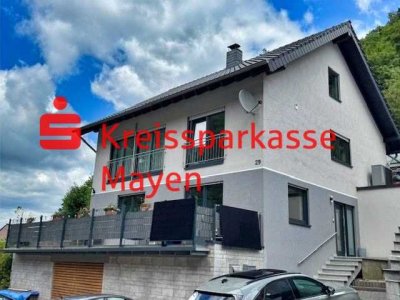 Stilvolle Maisonette-Eigentumswohnung mit Garten und Kamin in ruhiger Lage