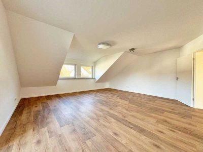 Top für Kapitalanleger: Modernisierte DG-Wohnung mit Westbalkon & Garage