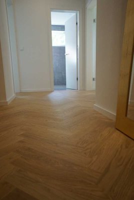 Grüne Oase: Hochwertig sanierte 3 Zimmer Wohnung mit Gartenzugang