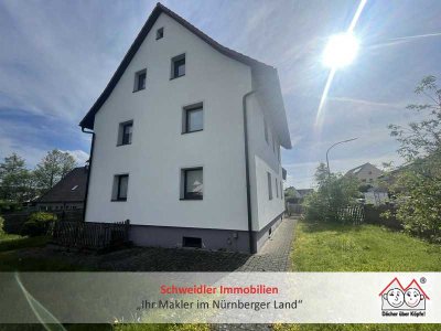 Familie willkommen: 1- bis 2-Parteienhaus mit Garten und Garage in Igensdorf zur Miete