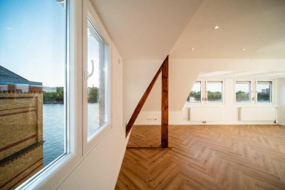 Sanierte Dachgeschosswohnung mit zwei separaten Einheiten und traumhaftem Rheinblick!