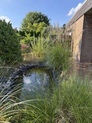 Wohnen auf einer Ebene im L-förmigen Reihen-Bungalow