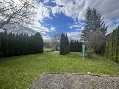 ERDGESCHOSSWOHNUNG MIT GARAGE UND GARTENANTEIL