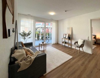 Erdgeschosswohnung mit beeindruckender Wohnfläche, Terrasse und elegantem Raumzuschnitt.