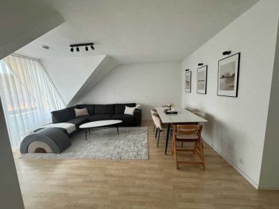 Helle Dachgeschosswohnung mit Balkon im Zentrum und unmittelbarer Rheinnähe