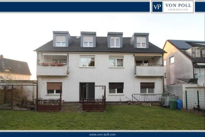 Wohn- und Geschäftshaus mit großem Garten und Garagen