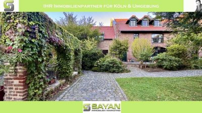 SAYAN Immobilien - Rondorf: Traumhafte Gartenwohnung in historischer Hofanlage + 2 PKW-Stellplätze -
