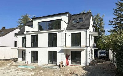 Neubau-Erstbezug: Großzügige EG-Wohnung zzgl. Souterrain mit Privatgarten - stadtnah und im Grünen
