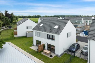 Ihr neues Zuhause: Modernes Mietshaus mit Garten und Garage