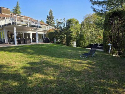 Exklusive Großwohnung über 2 Ebenen mit idyllischem eigenem Garten und Spa-Bereich in bester Lage!