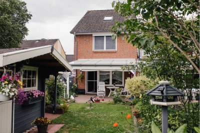 Ideal geschnittenes Endreihenhaus mit niedlichem Garten und Terrassenüberdachung