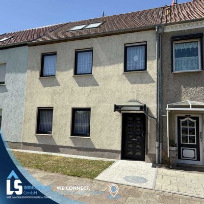 Charmantes Reihenmittelhaus mit modernisiertem Dachgeschoss, liebevoll gestaltetem Garten