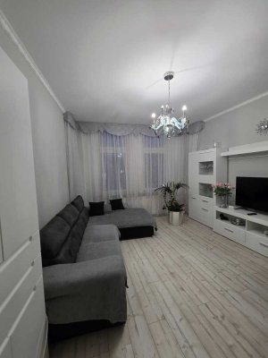 Stilvolle Altbauwohnung mit Westbalkon und moderner Einbauküche in zentraler Lage