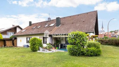 Viel Raum für Ihre Familie: Großzügiges Zweifamilienhaus mit Gartenparadies