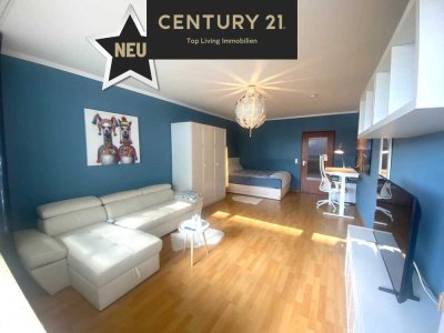 Stilvolles 1-Zimmer-Apartment mit Balkon, Ausblick ins Grüne und Citylage – komplett möbliert
