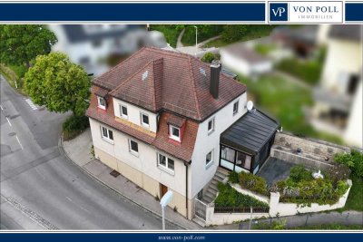 Charmantes Einfamilienhaus mit zwei Wohneinheiten, Wintergarten, Garage und historischem Felsenkelle