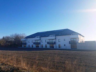 EINMALIGE CHANCE: TRAUMHAFTE ECKWOHNUNG MIT TOLLEM BALKON IN BEGEHRTER WOHNLAGE IM ERSTBEZUG INKL. ÜBERDACHTEM PARKPLATZ