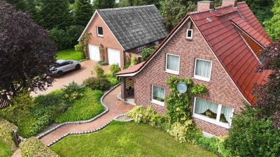 EINFAMILIENHAUS MIT WINTERGARTEN UND DOPPELGARAGE AUF GROSSEM NATURGRUNDSTÜCK