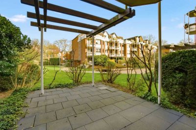 Wohnen im Grünen – Stilvolle Erdgeschosswohnung mit Terrasse und Gartenblick