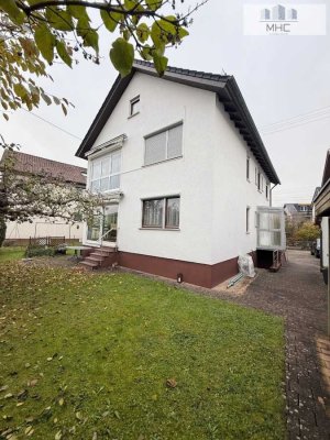 Attraktives Zweifamilienhaus mit viel Potenzial - Ideal für Familien und Investoren.