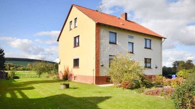 Mit Weitblick: Ein- bis Zweifamilienhaus in Feldrandlage!