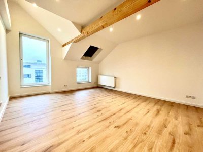 Stilvoll sanierte 2-Zi.-DG-Whg. mit EBK im energieeffizienten Wohnensemble